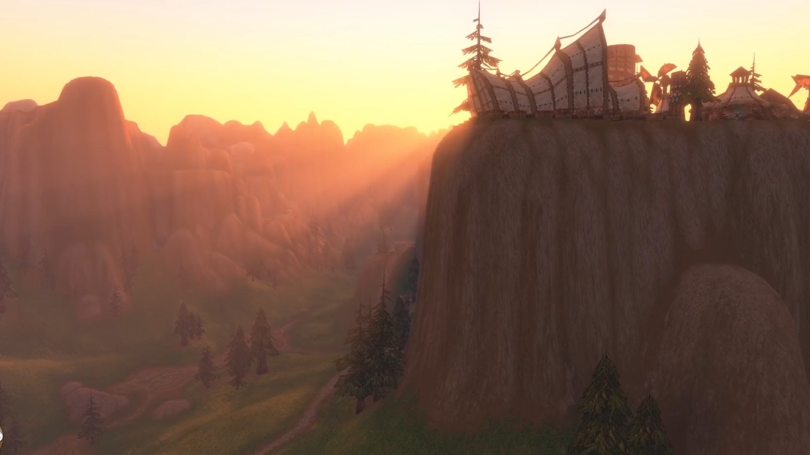 Mulgore — Mulgore mesa with tauren structures: the mountain now casts shadows and light shafts through the haze. — Forever
